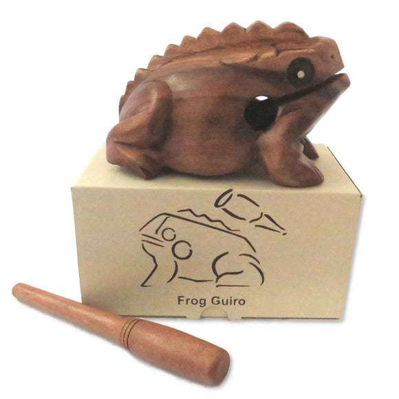 Wooden frog guiro with box on a white background