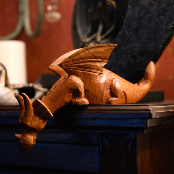 Wooden dragon on side board