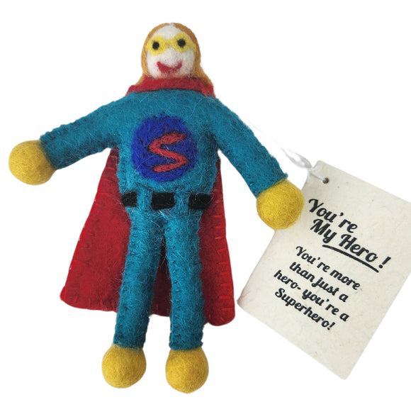 Handmade felt superhero gift tag/keepsake with a blue body, red cape, yellow gloves and feet, and a white face. It has a paper tag that reads 'You're My Hero! You're more than just a hero- you're a Superhero!'.