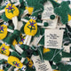 A pile of handmade felt flower fairies in green and yellow with embroidered faces and stems, attached to white tags that read 'For the Eco-Warrior in You. Thank you for fighting for a brighter greener future!'.