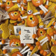 A pile of handmade felt fairies/pixies gift tags in orange, yellow, and white, with a small white 'Thank You' tags.