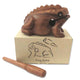 Wooden frog guiro with box on a white background