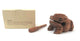 Wooden frog-shaped musical instrument with gift box showing instructions