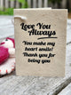 A handmade paper thank you gift card with black printed text reading 'Love You Always. You make my heart smile! Thank you for being you'.