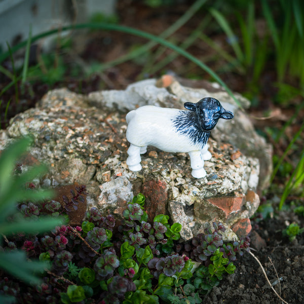 Sheep standing on rock ornament