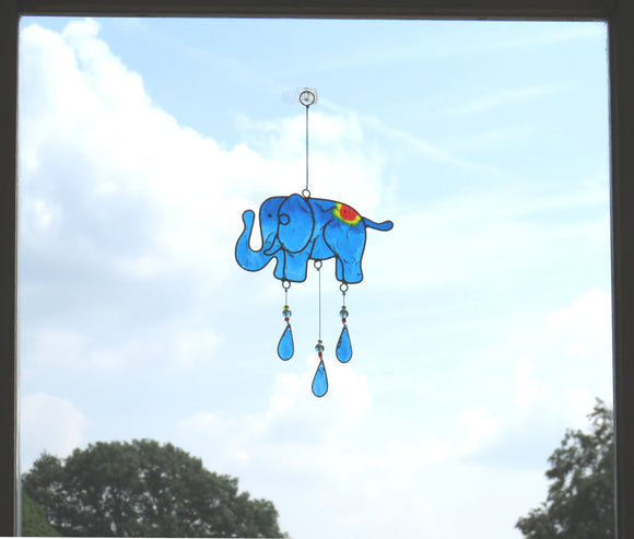 elephant suncatcher hanging in window