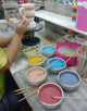 Hand painting a rainbow mug