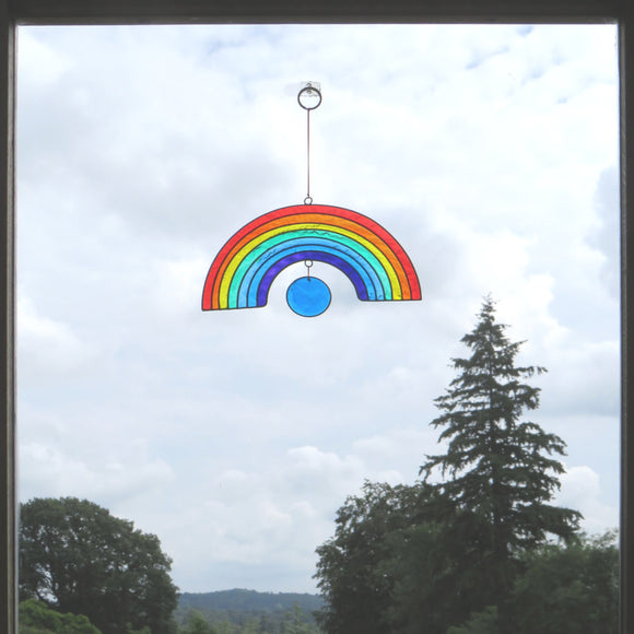 Rainbow suncatcher hanging in window